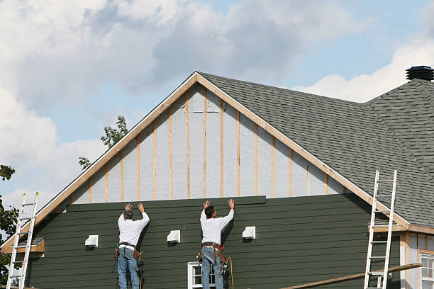 Professional Storm Damage Siding Repair technician working in Charleroi, PA